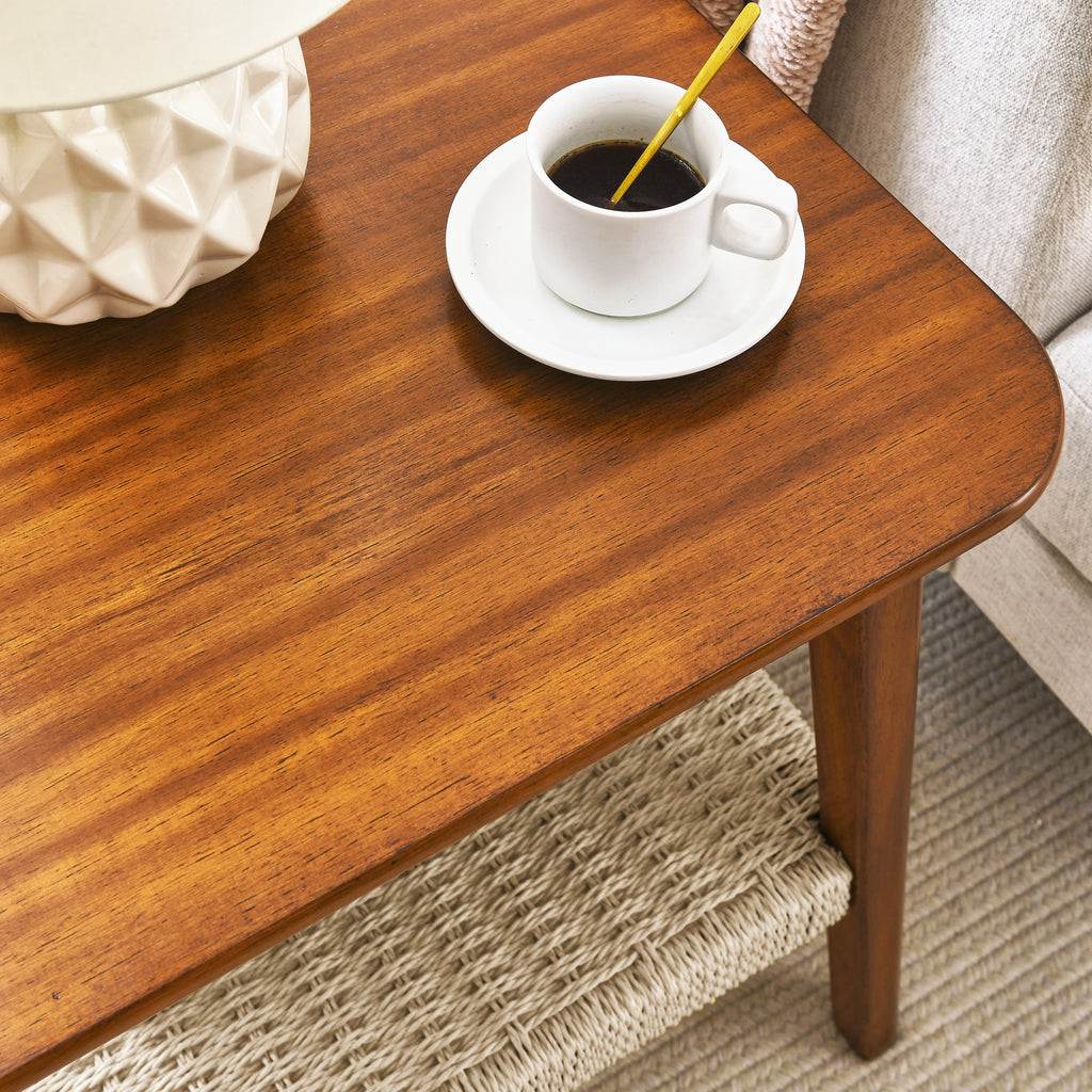 Walnut-tone side table — detail of the rounded top corner with a coffee cup