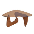 Tinted glass coffee table with a sculptural curved brown base on a plain white background