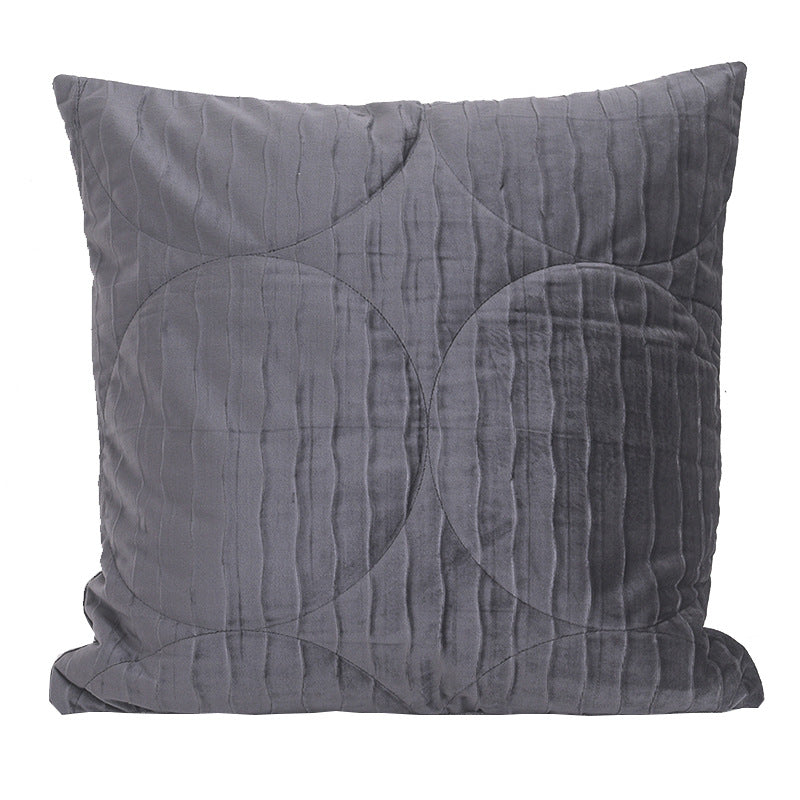 Quilted velvet pillow cover in smoke grey, square, with overlapping circle stitching, on a plain white background