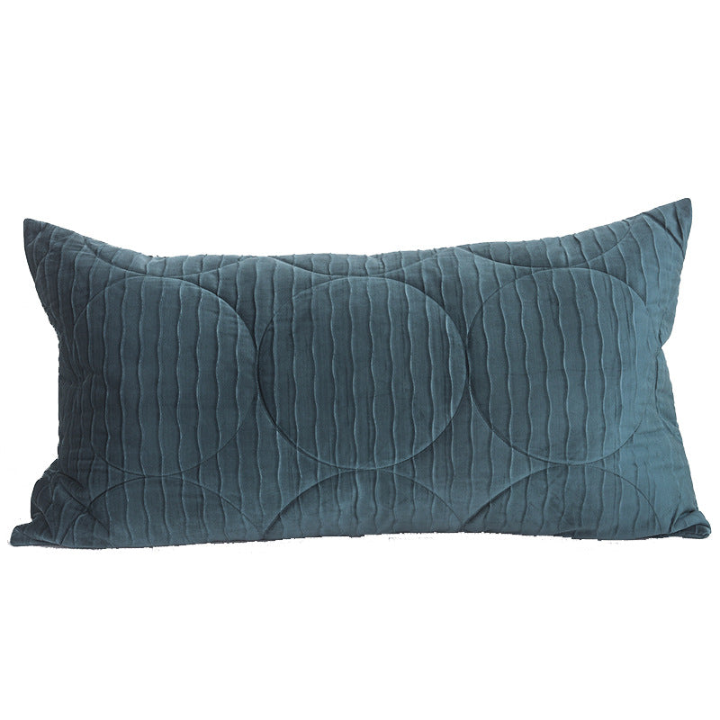 Long lumbar quilted velvet pillow cover in teal on a plain white background