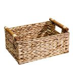Rectangular woven straw storage basket with wooden dowel handles on a plain white background