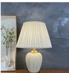 Ribbed cream ceramic table lamp — close view of the crackle glaze and pleated shade