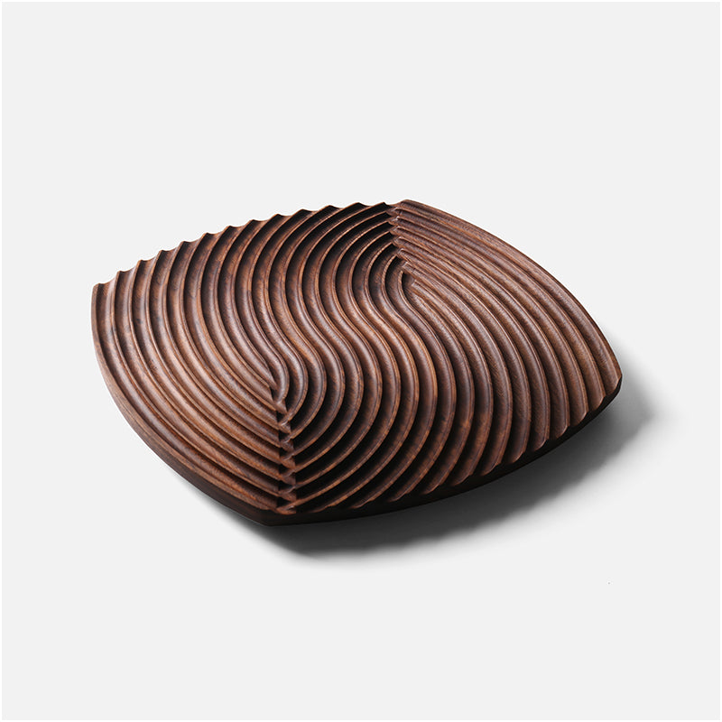 Ripple-carved wood trivet tray in Walnut, large size, on a plain light gray background