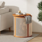Cane drum side table with its top shifted to show a gray throw tucked inside