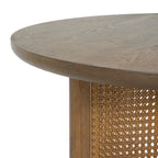 Round cane coffee table — detail of the eased top edge and woven cane panel