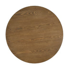 Round cane coffee table — top-down view of the open wood grain