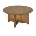 Round cane panel coffee table with cross base in walnut-brown wood, on a plain white background