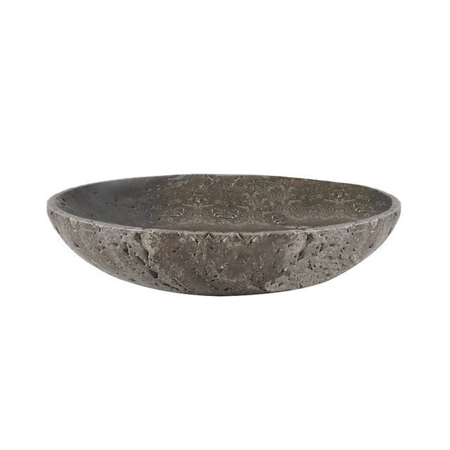 Silver gray travertine shallow bowl, side view on a plain white background