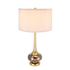 Smoked glass gourd table lamp with white drum shade, lit, on a plain white background