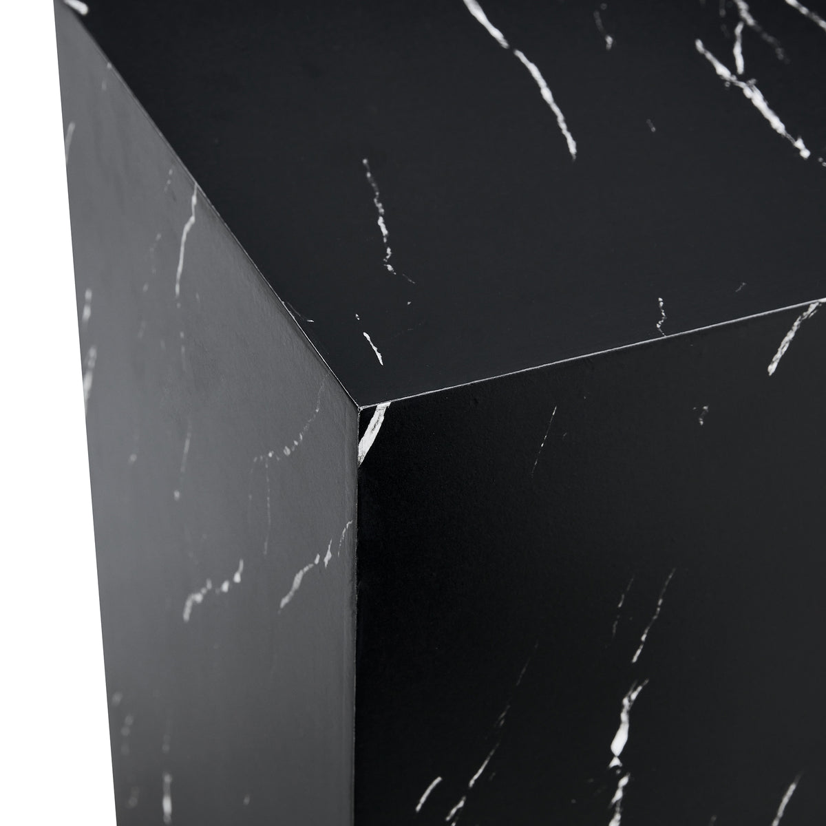 Faux marble pedestal side table — detail of the white veining at the top corner