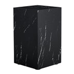 Square black faux marble pedestal side table with white veining, on a plain white background