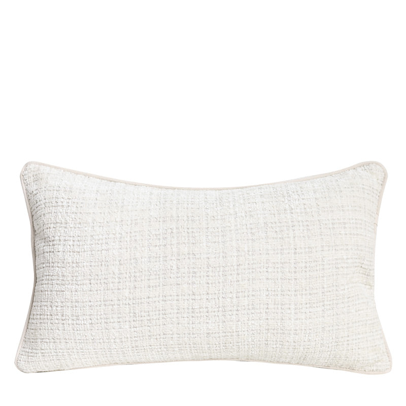 Textured chenille lumbar pillow cover in ivory with a nubby woven face on a plain white background