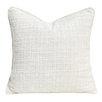 Textured chenille pillow cover in ivory, square, with piped edge on a plain white background