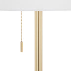 Gold floor lamp — detail of the slim stem and bead pull chain under the linen shade