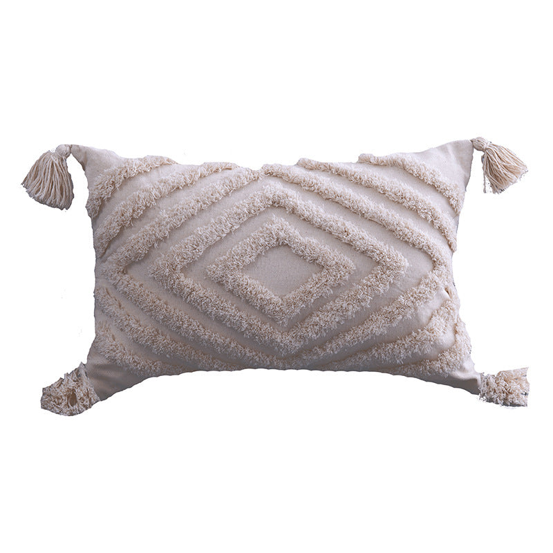 Lumbar cream tufted pillow cover, concentric diamond pattern, on a white background