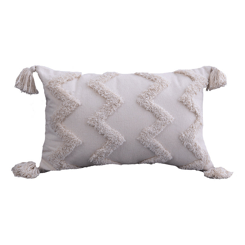 Lumbar cream tufted pillow cover, zigzag pattern, on a white background