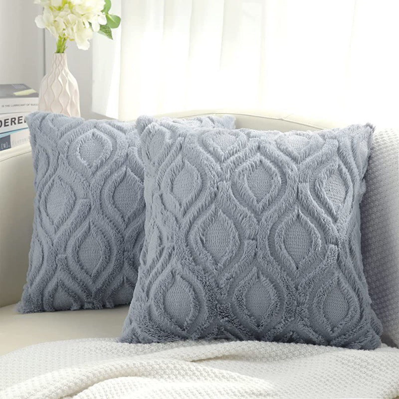 Tufted ogee plush pillow cover in grey, two square pillows on a cream sofa by a sheer curtain