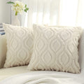 Tufted ogee plush pillow cover in beige, two square pillows on a cream sofa by a sheer curtain