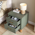 Olive green nightstand with both drawers open beside a bed