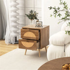 Rattan half-moon nightstand with both drawers open beside a cream armchair