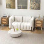 Pair of rattan nightstands flanking a white sofa in a living room