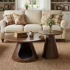 Walnut-finish cone coffee table and taller side table before a cream sofa on a jute rug