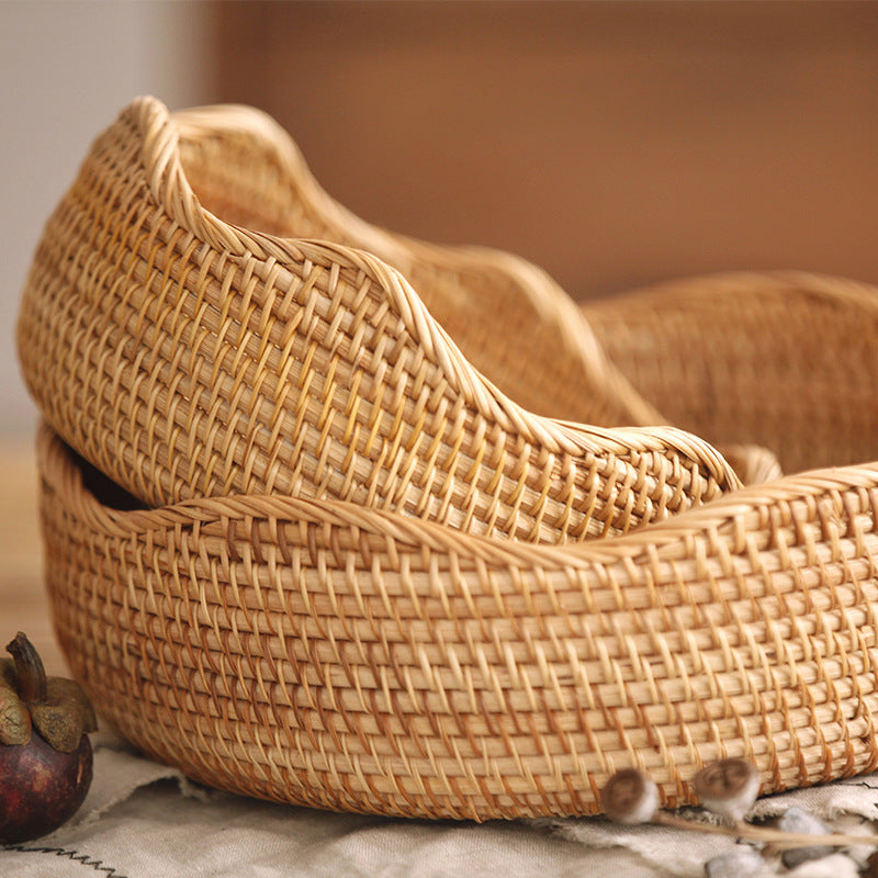 Small and large wavy-rim woven fruit baskets nested together — detail of the tight weave