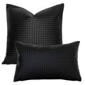 Black woven faux leather pillow covers in square and lumbar sizes on a white background