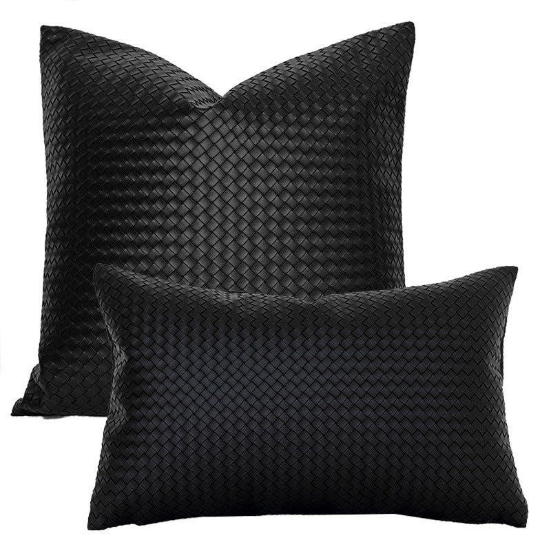 Black woven faux leather pillow covers in square and lumbar sizes on a white background