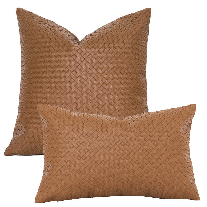 Caramel woven faux leather pillow covers in square and lumbar sizes on a white background